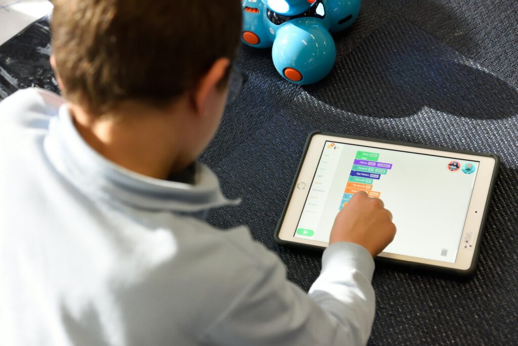 Kid using silver iPad